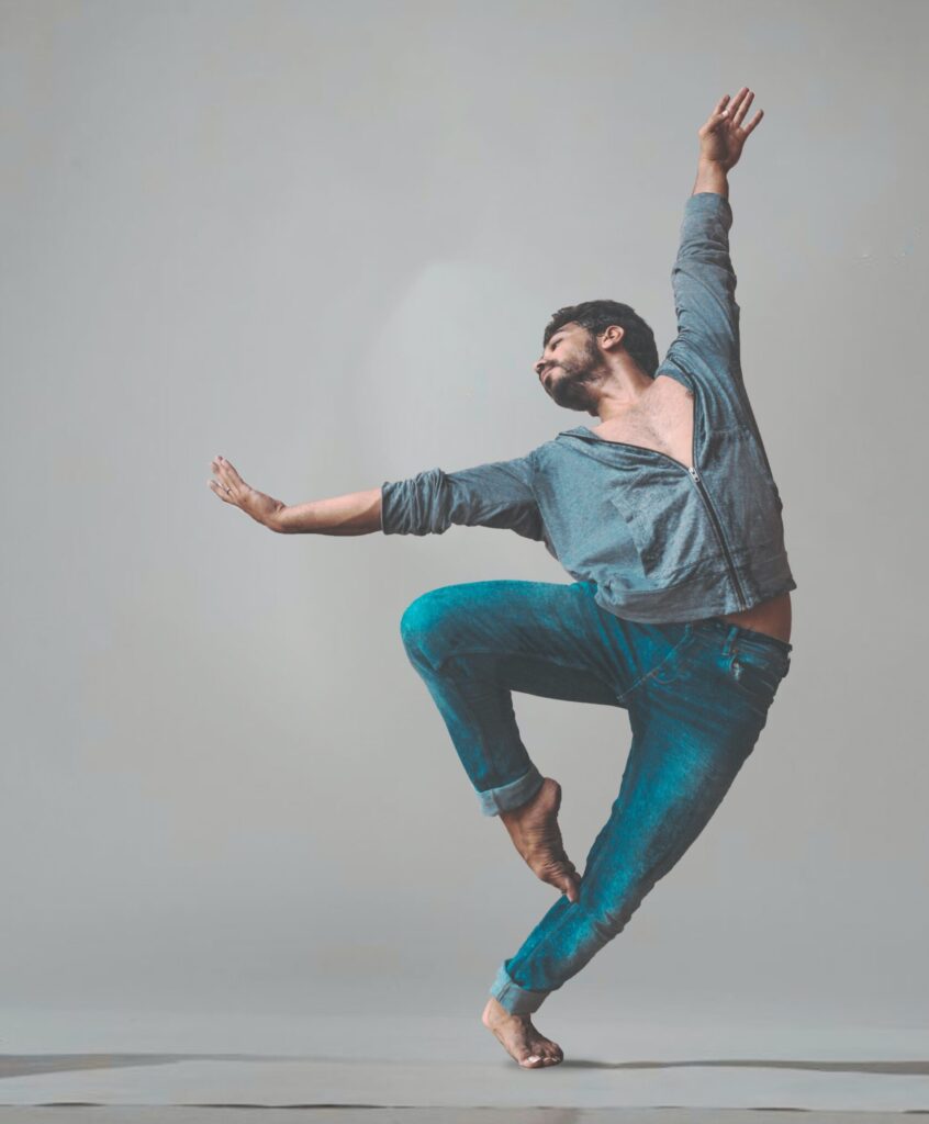 Young adult man performing a modern dance.